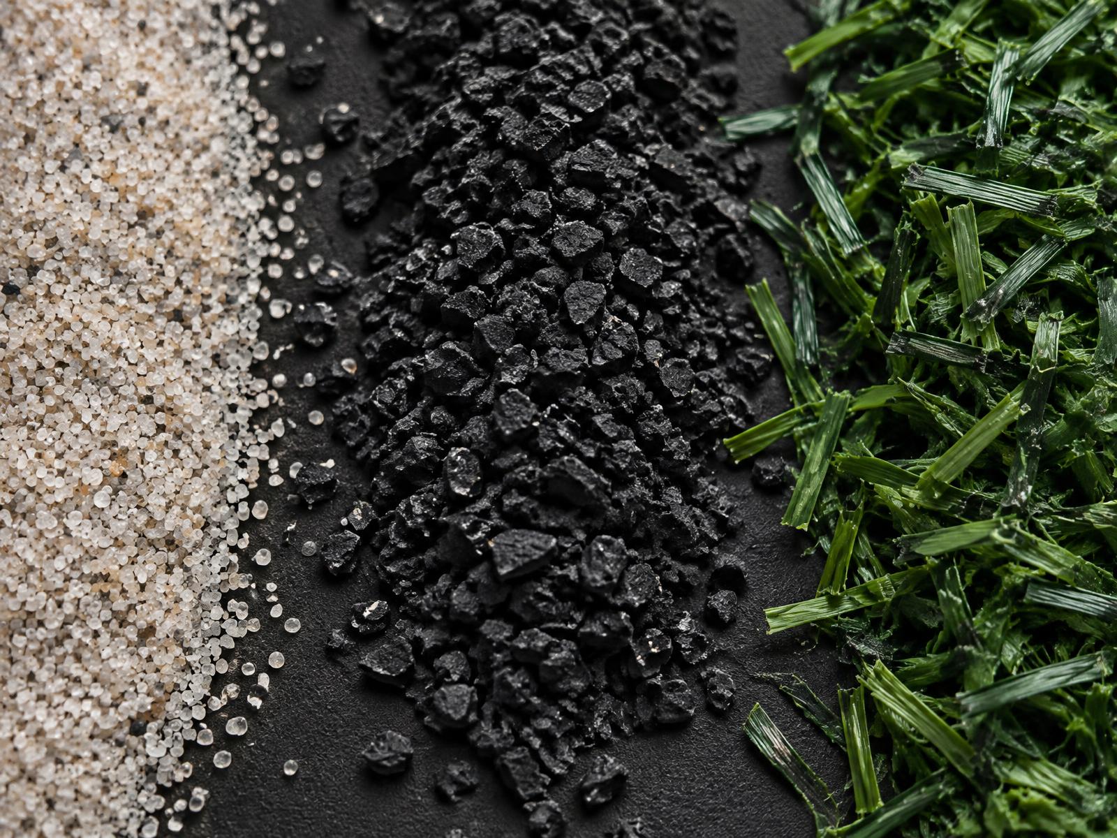 Separated recycling fractions: silica sand, rubber granulate and synthetic turf fibers